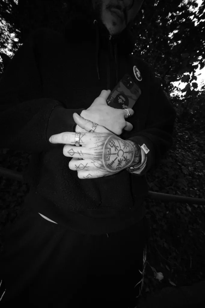 Duarte’s hands, rings, and vegvísir tattoo